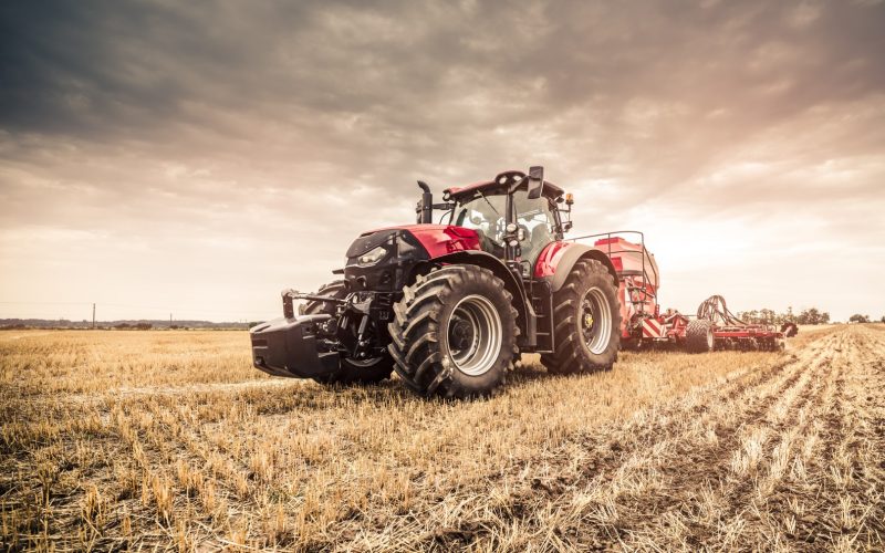 Modern,Red,Tractor,Seeding,Directly,Into,The,Stubble,With,Red